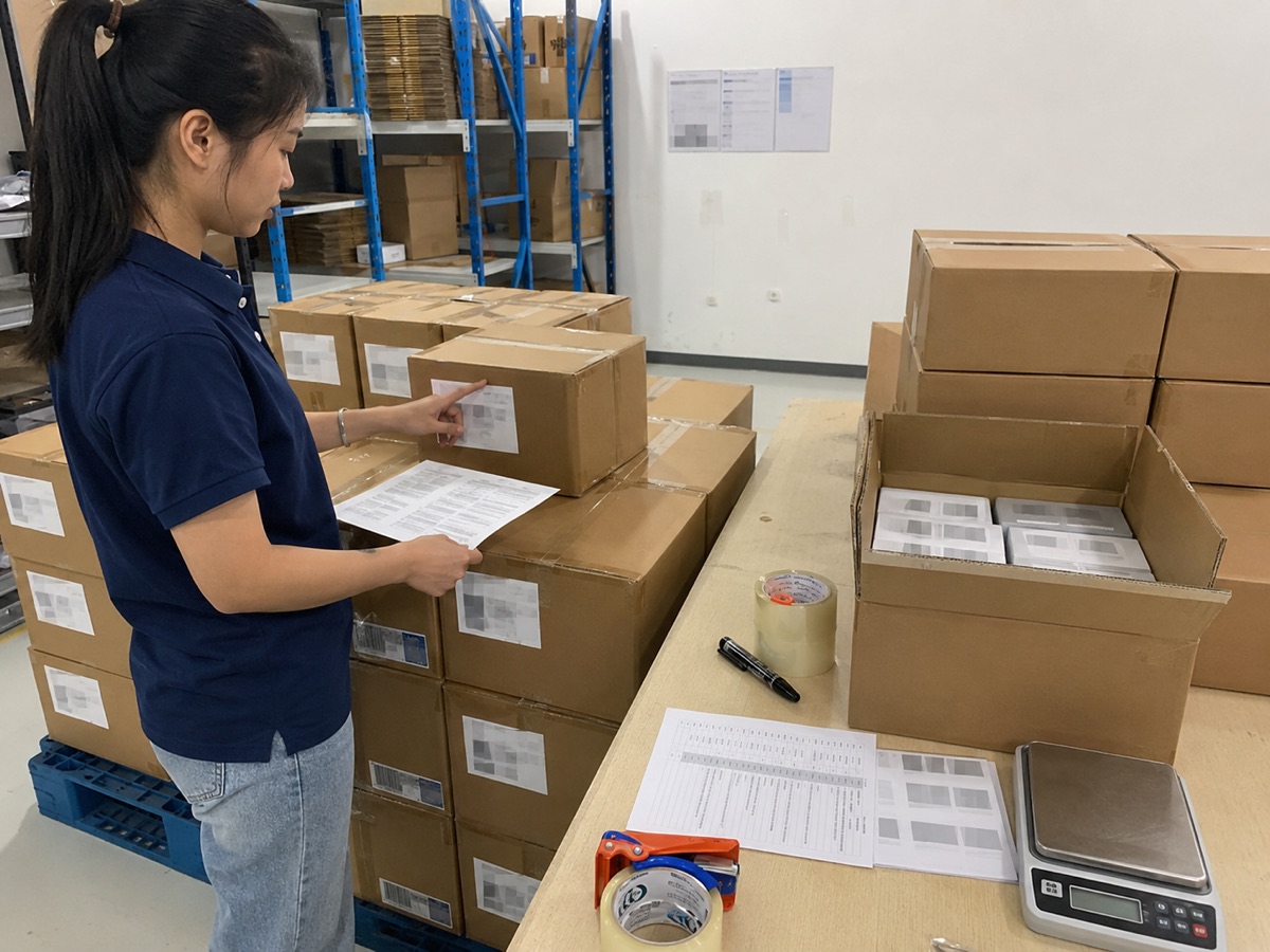 Shipment carton label checked before goods are handed off for delivery